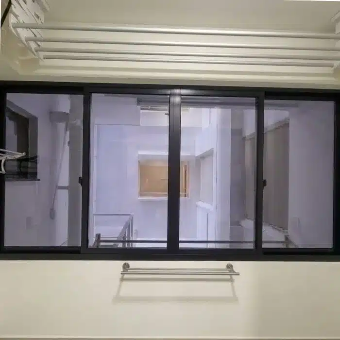 Daytime interior view of kitchen yard with installed one-way mirror film providing privacy while allowing clear outward visibility